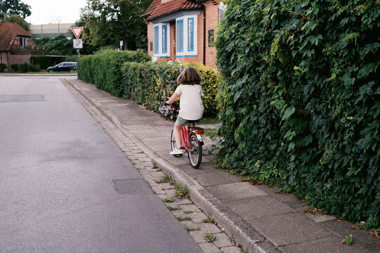 backside view of little girl on bike in Germany