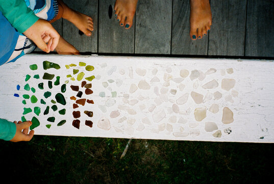 Mother and child sort sea glass together