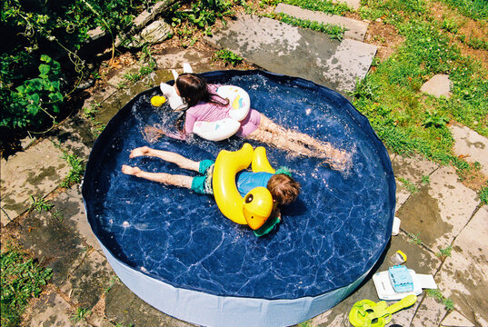 Kids in a kiddie pool in summer