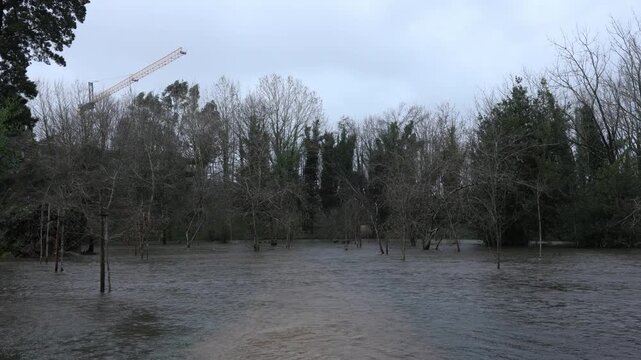 River flooding a urban park in Porto. Natural disaster.
