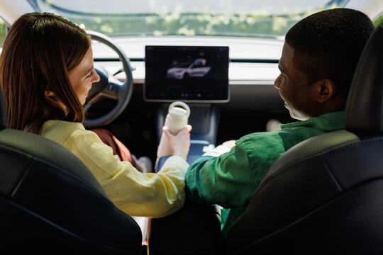Couple Sharing a Moment Inside a Modern Electric Car