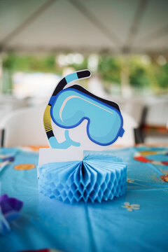 Summer party table decoration with blue diving mask cutout