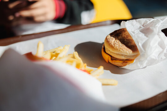 Burger and fries on a tray.