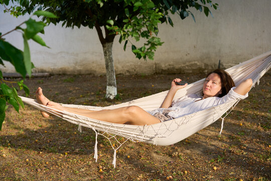 Woman relaxing in a hammock