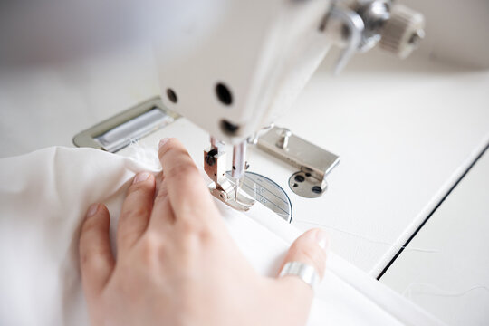A close-up of a sewing machine in action.