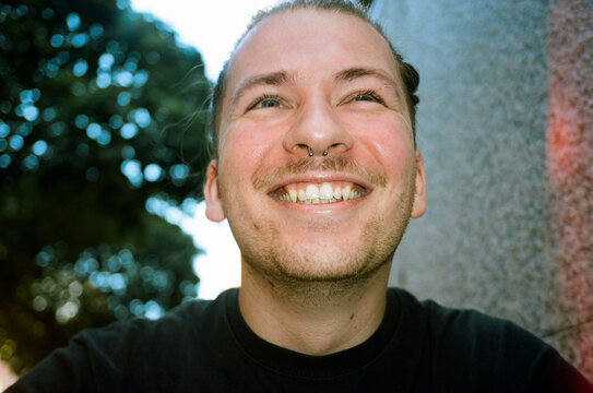 Young Man smiling in a Park