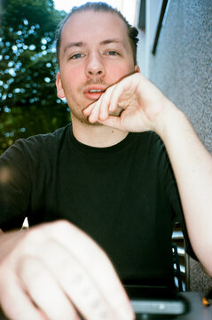 Point of view of a Man Sitting at a Table chatting with a friend.