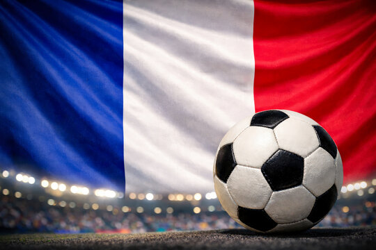 Football on a world cup stadium against France Flag and blurred gallery full of people with copy space for text