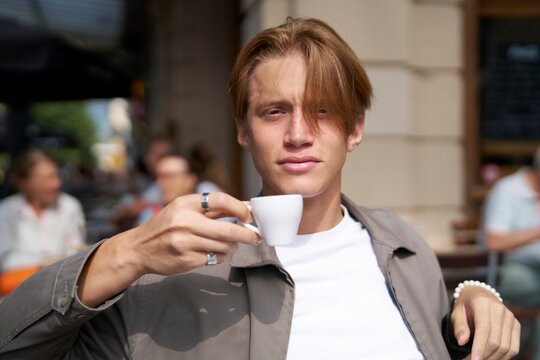 Sipping Espresso at a Vibrant Outdoor Cafe Amidst Lively Chatter