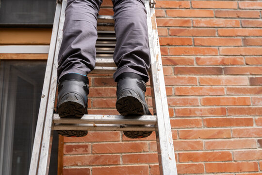 Safety shoes on ladder