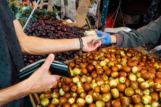 Man Paying Cash for Fresh Jujube Fruit,  Chinatown, NYC