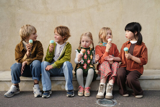 Children enjoying ice cream together