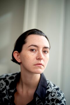 Young Woman With Freckles Posing Indoors in Natural Light