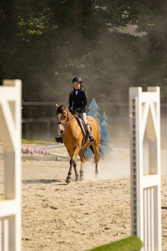 Young Girl in horse showing competition 