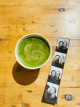 Matcha tea latte and Photograph of happy couple in photo booth