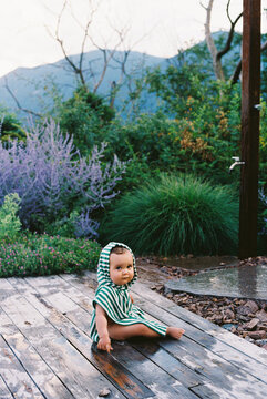 Baby in Hooded Towel Outdoors on Deck Film Photo 