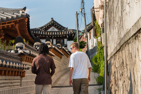 Two Tourist Exploring The Bukchon Hanok Village Alley, South Korea.