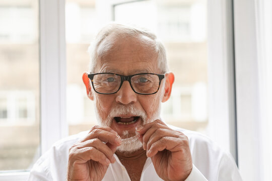 Senior Man Practicing Dental Hygiene