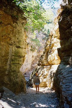 Portrait of teenage girl exploring canyon during vacation in Greece 