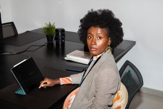 Businesswoman using tablet computer at office 