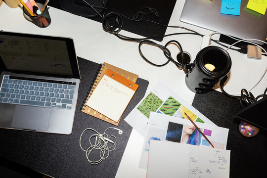 Creative Workspace With Technology, Notes, and Documents