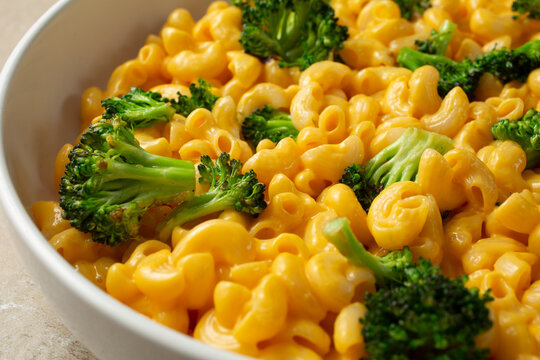 A closeup view of a plate of dairy-free, gluten-free broccoli mac n cheese.