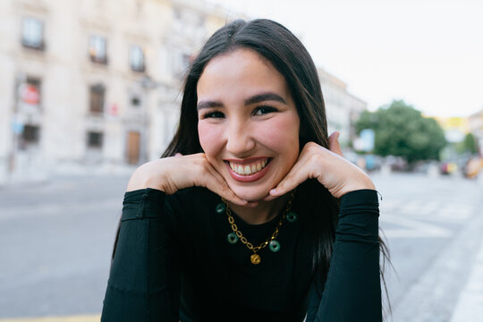 Smiling Woman in Urban Setting