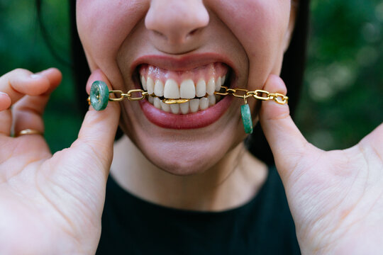 Closeup of Teeth and Jewelry Interaction