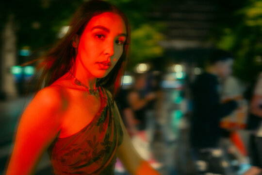 Young Woman in Vibrant Urban Scene