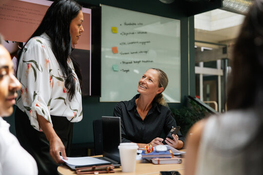 Colleagues sharing ideas during a collaborative meeting 