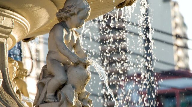 Close Up of Cherub Statue and Water Splashing in Carriedo Fountain