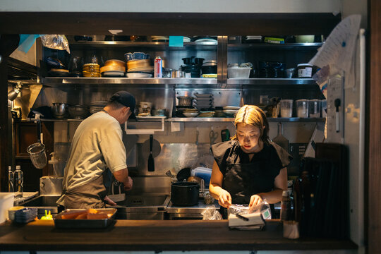 Japanese cuisine being prepared by focused chefs