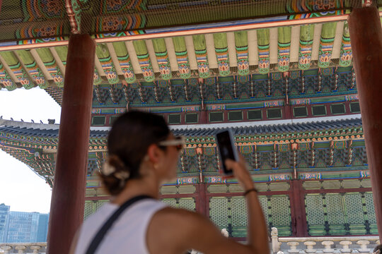 Visitor Capturing the Beauty of Traditional Architecture in Seoul