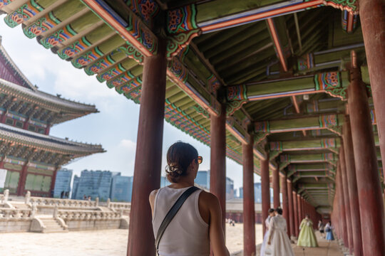 Woman Exploring Traditional Architecture in Gyeongbokgung Courtyard