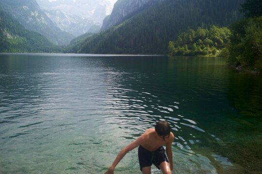 Enjoying a Warm Summer Day by the Clear Lake in the Mountains