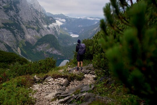 Hiker Enjoys Breathtaking Mountain View Near Serene Lake