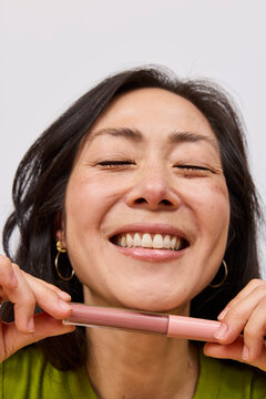 Beautiful asian woman with brown lipstick
