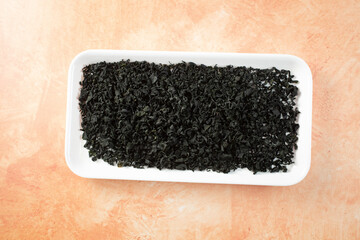 A top down view of a tray of dry cut wakame. © DAVID