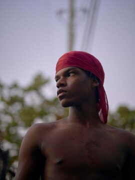 Young Man Enjoys a Serene Moment in the Evening Light