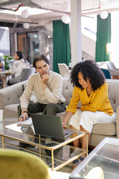 Collaborative teamwork in a modern workspace with digital tools