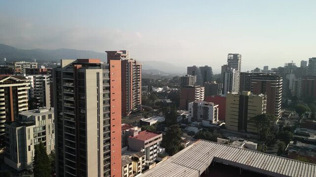 Aerial downtown Guatemala City skyscrapers with smoggy skies in zona 14