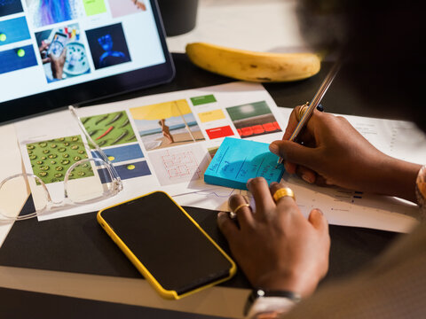 Businesswoman taking notes at office 
