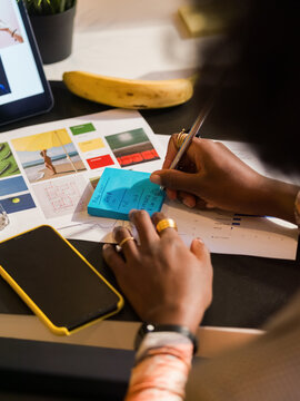 Woman writing notes at work 