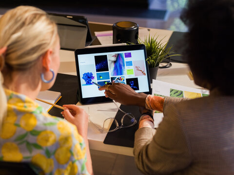 Designer discussing project with creative director