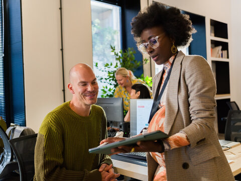 Cheerful businesspeople working at office