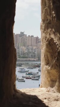 View of Alexandria Harbor Through Defensive Arrow Slit Window in Qaitbay Citadel Fortress