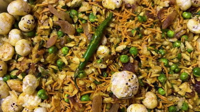 savory indian snack mixture with spices nuts and puffed seeds top view