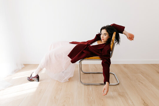 Woman lying on chair