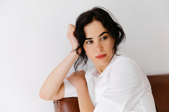 Woman thinking on sofa