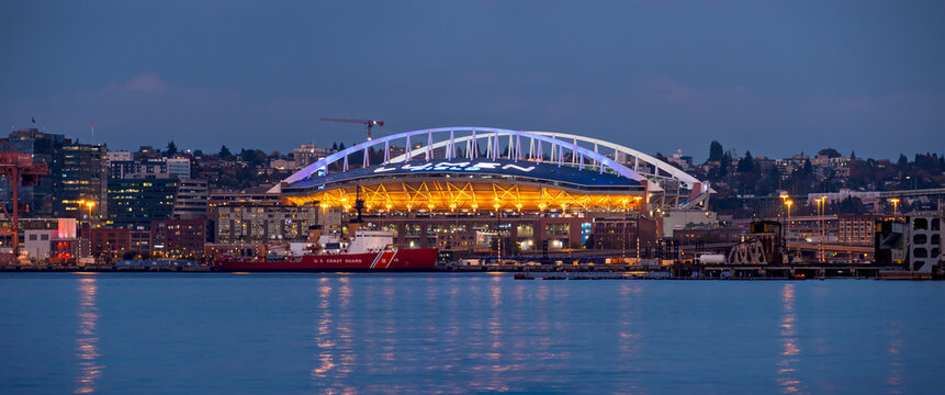 Lumen Field and Seattle skyline reflecting in Puget Sound